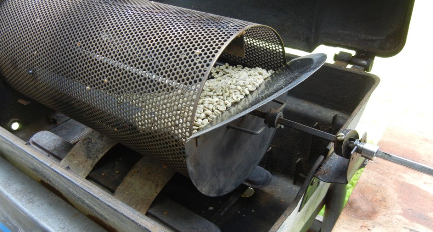 The gas grill came from the town dump, the roasting basket and rotor from eBay, the raw beans from Brooklyn. Photo by Catskill Eats
